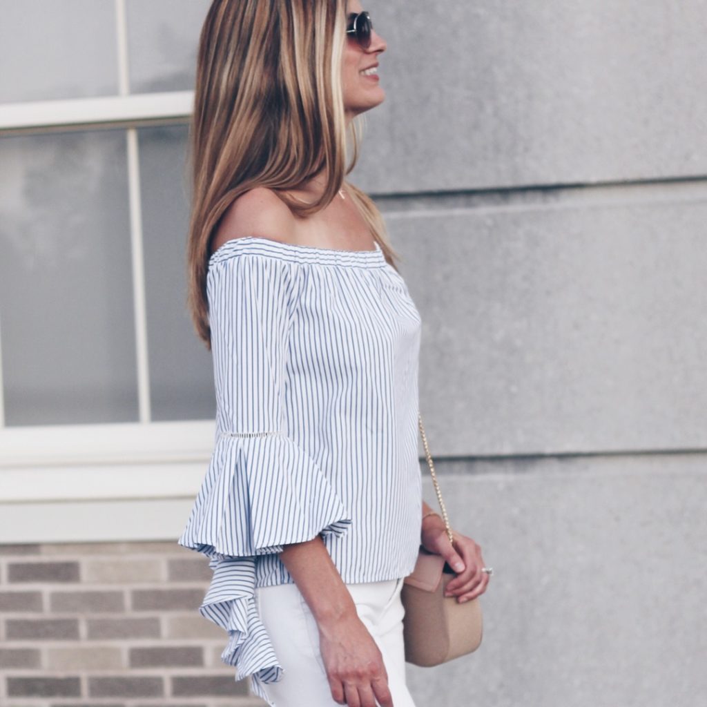 striped off the shoulder top with bell sleeves paired with white wide leg denim