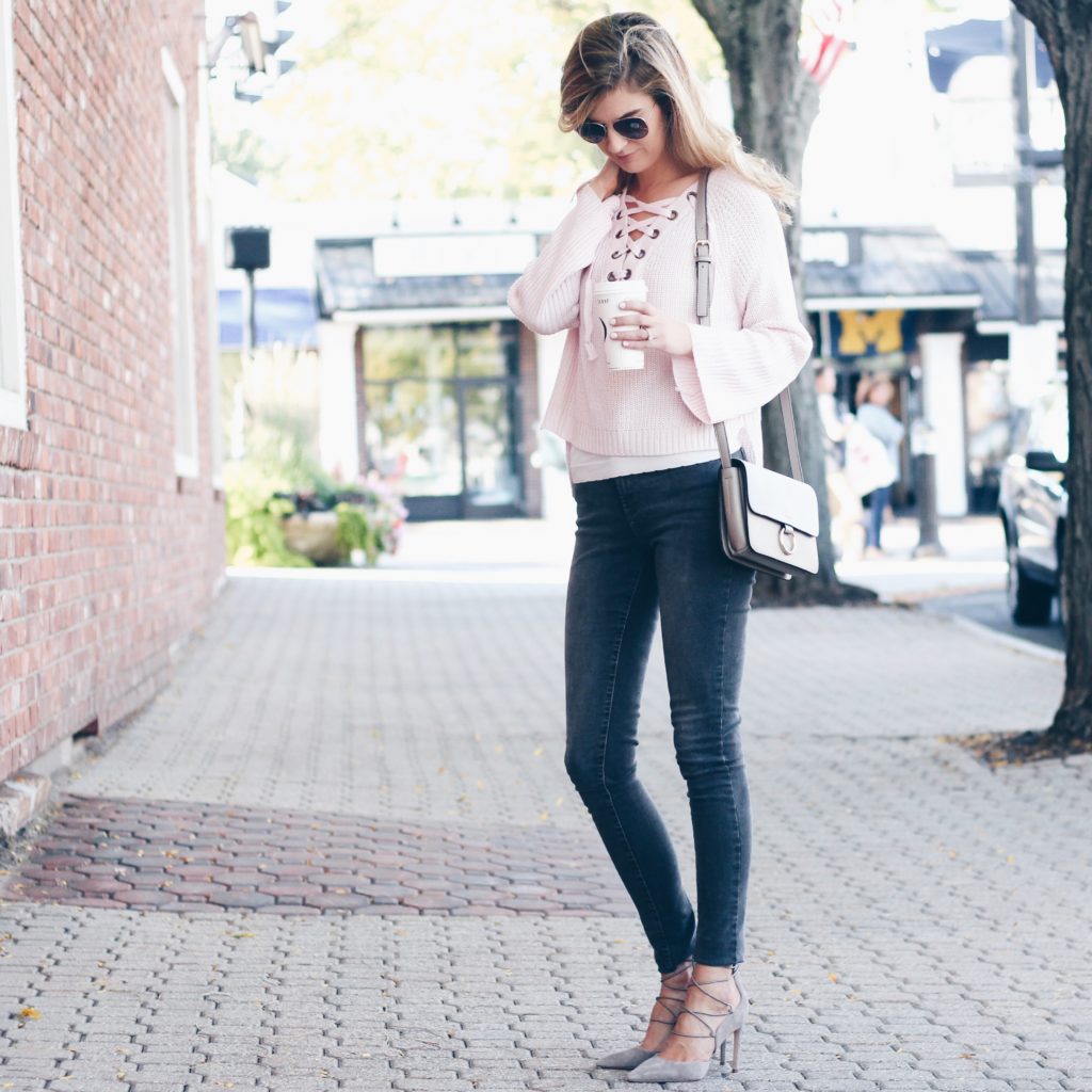 Connecticut life and style blogger, Pinteresting Plans shares a pink lace-up sweater and gray lace-up shoes for an easy fall outfit.