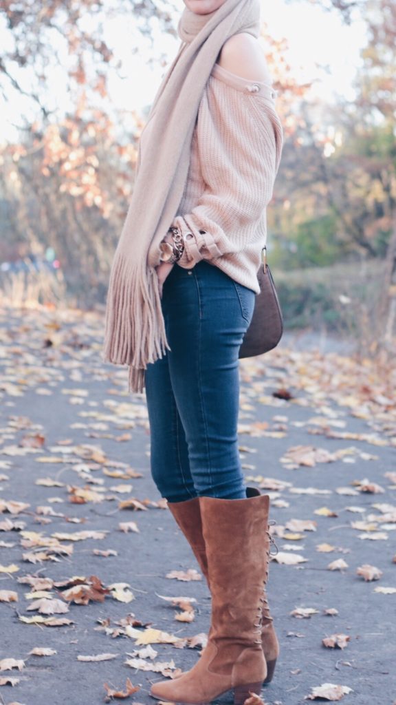 blush lace up sweater with free people camel fringe scarf and denim leggings and knee high suede boots