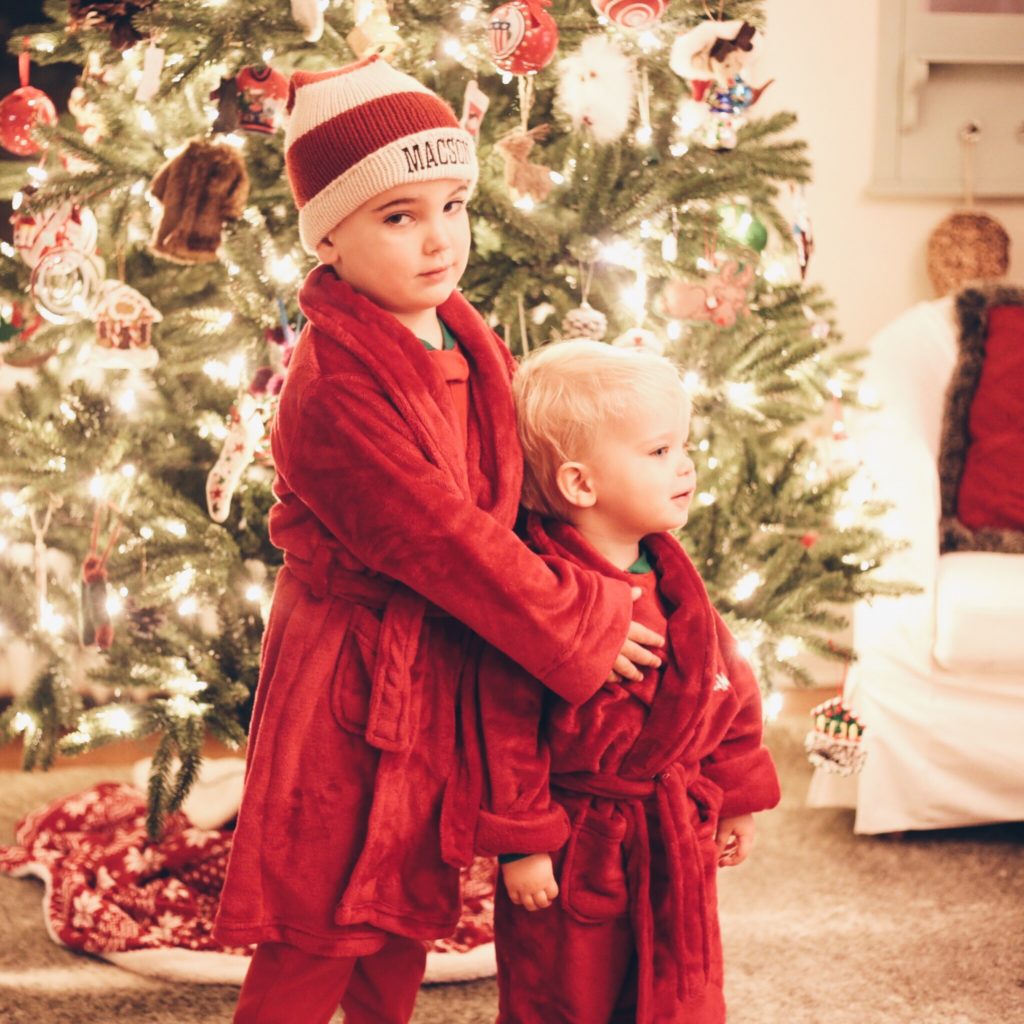 children in matching red christmas robes