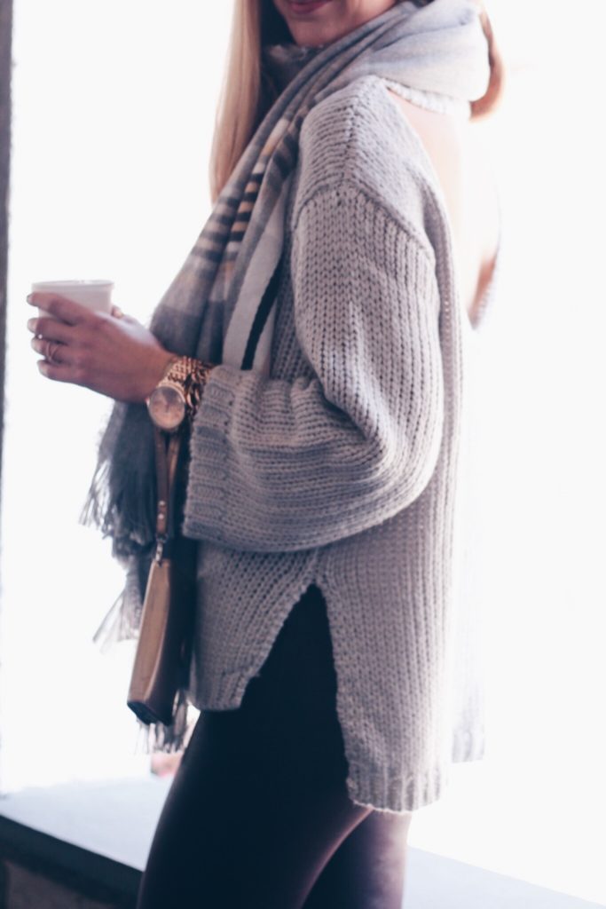 chunky knit gray open back sweater with gray plaid scarf
