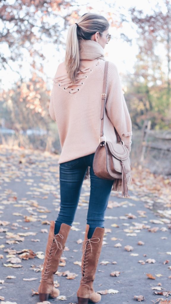 denim leggings outfit: lace up sweater and lace up back sole society knee high suede boots