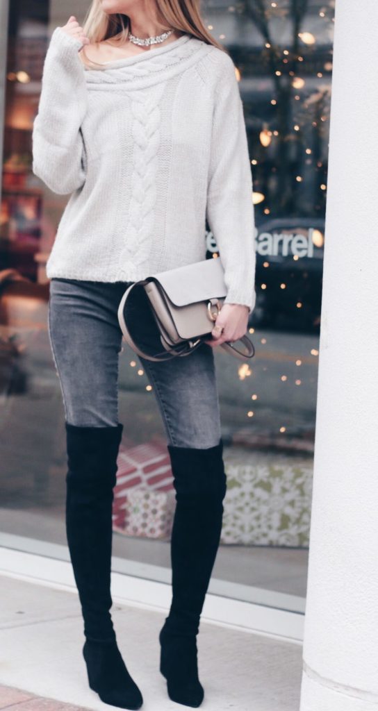 gray off the shoulder sweater with gray denim and black suede over the knee boots