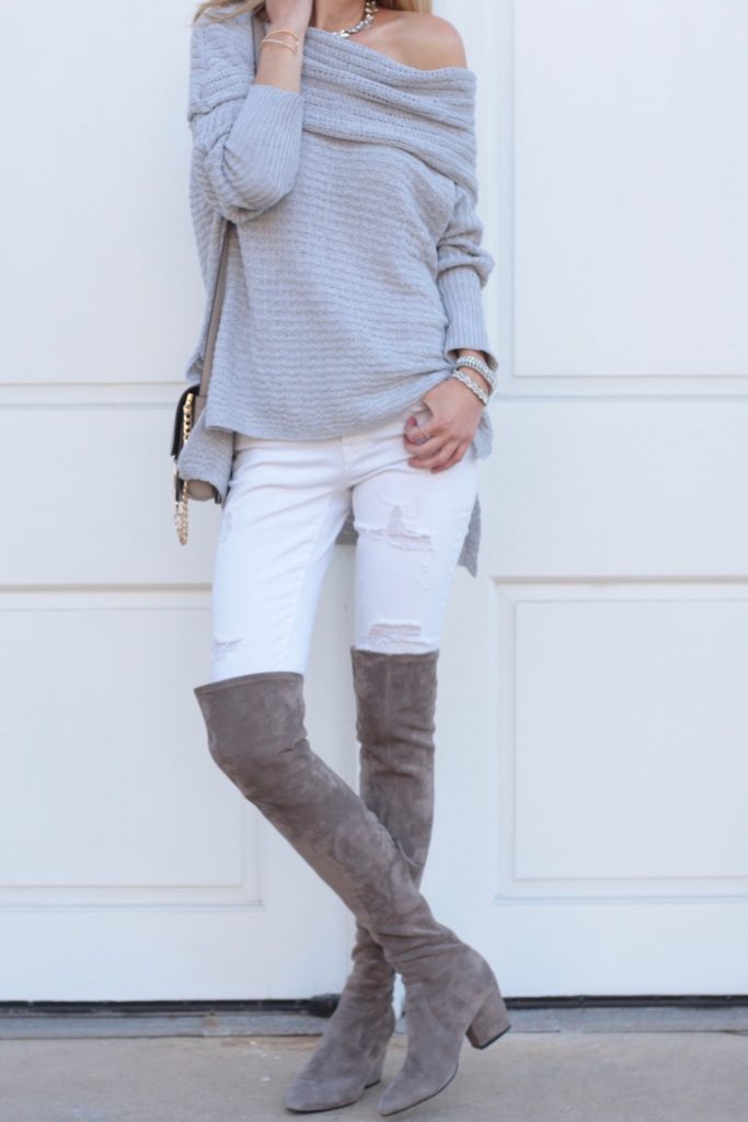 gray off the shoulder sweater with white denim and over the knee suede boots