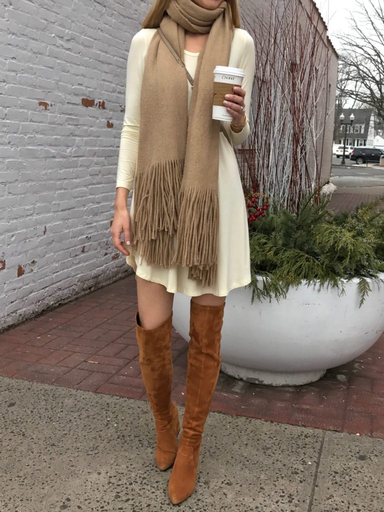 fall outfit: swing dress with neutral fringe scarf and cognac over the knee boots