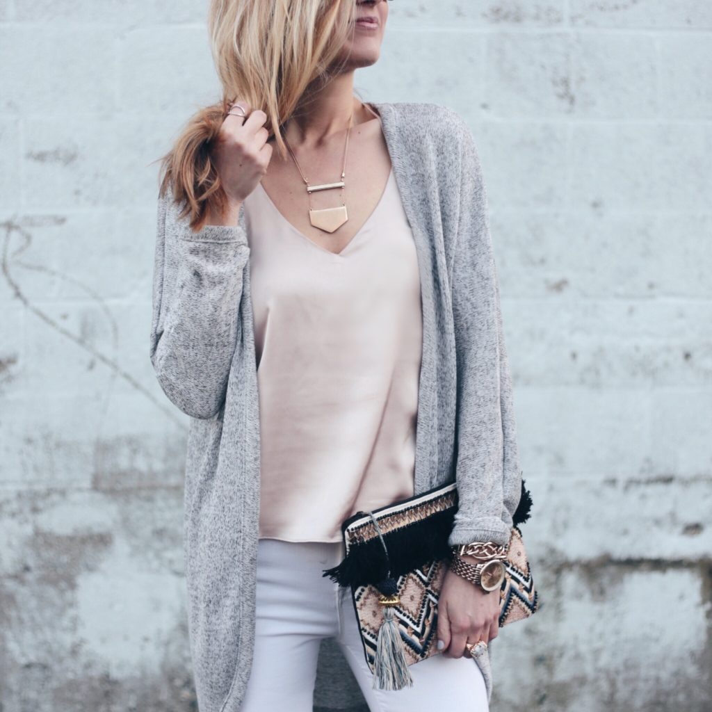 blush pink satin cami with gray sweater duster cardigan and jeweled clutch