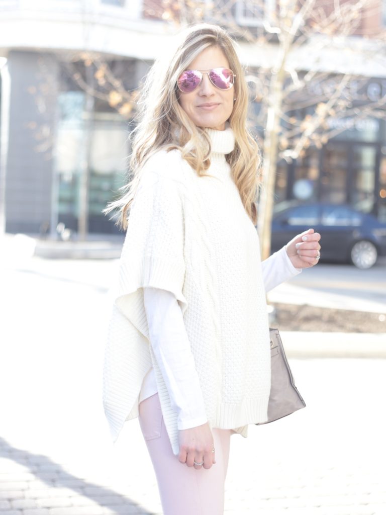 white sweater poncho with pink skinny jeans