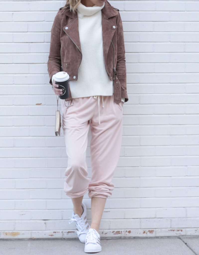 pink sweatpants with brown suede Moto jacket and rose gold Adidas joggers
