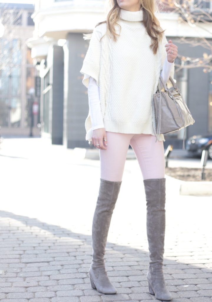 winter outfit: pink skinny jeans with white sweater poncho and gray over the knee boots