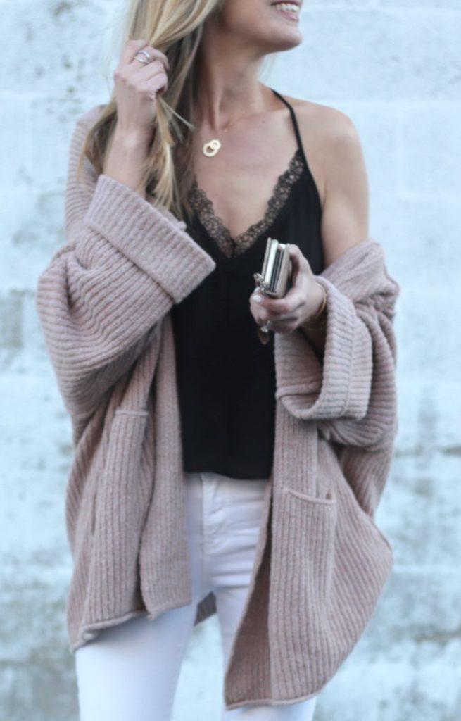 Connecticut life and style blogger, Pinteresting Plans shares 9 pink spring outfits and how to style them. You can check out those and more! slouchy pink free people cardigan over black lace ASTR cami