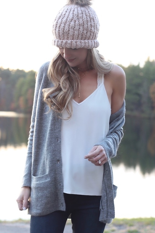 casual holiday outfits for the family - mom in sweater cardigan and white camisole over skinny jeans