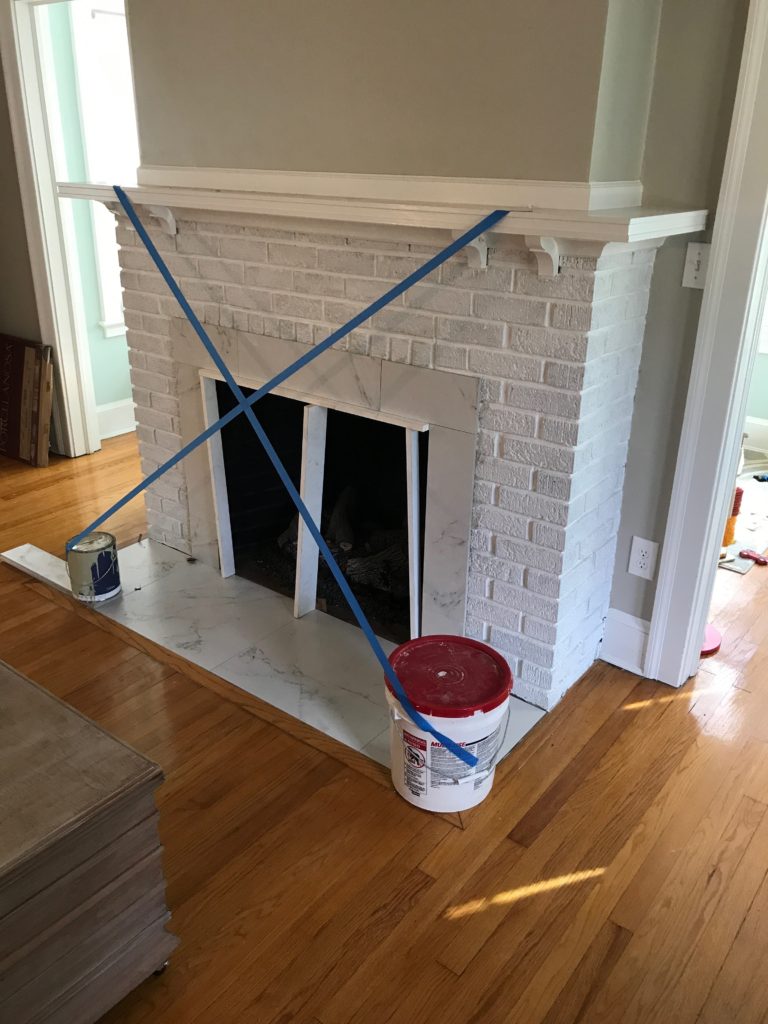 fireplace makeover before and after - tile hearth replaced and updated