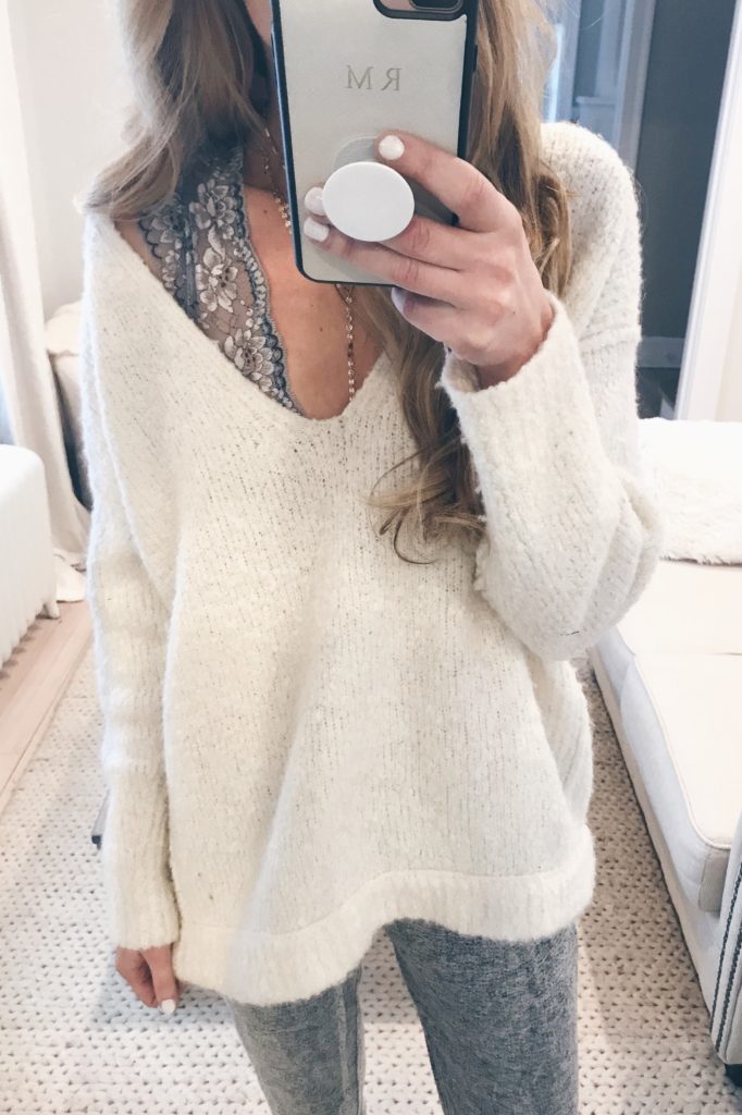 cute bralettes to add to your winter wardrobe - under an oversized white free people sweater