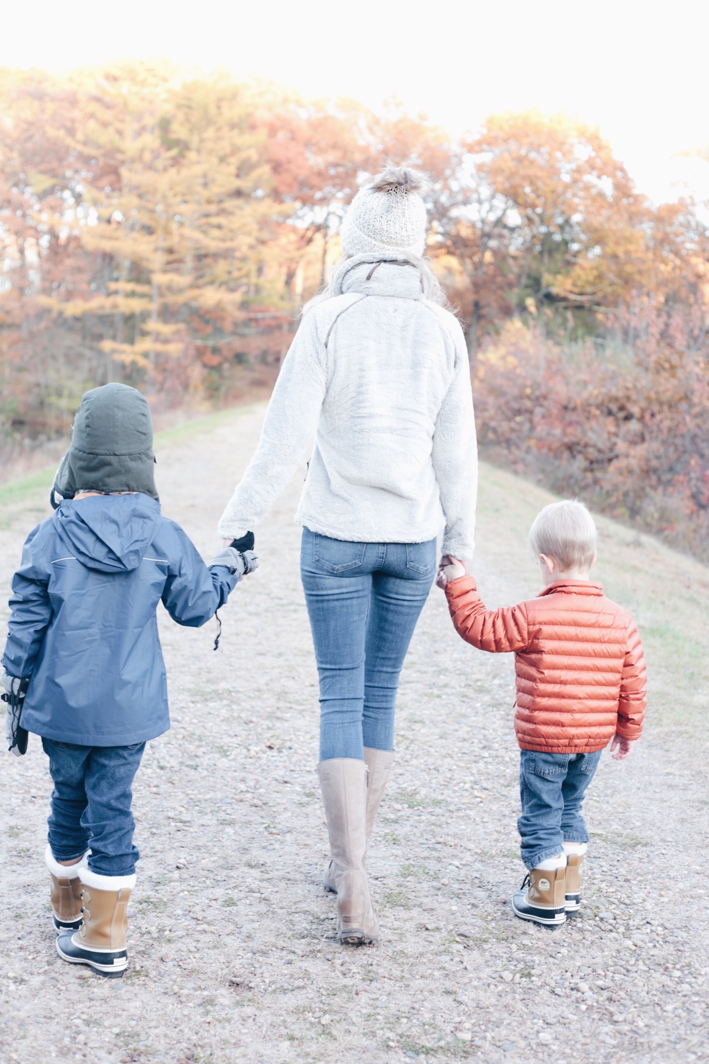  fall layers for the famly p interesting plans fashin blog mom and boys walking on trail