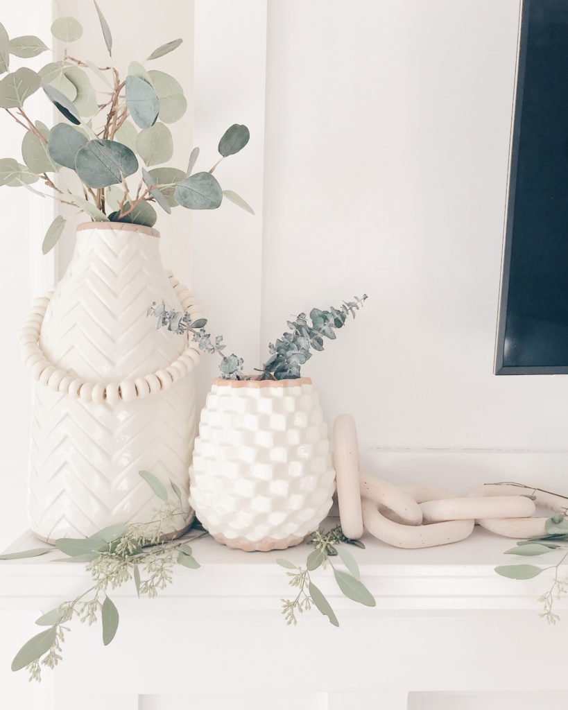 textured vases and eucalyptus - neutral fall mantle decor