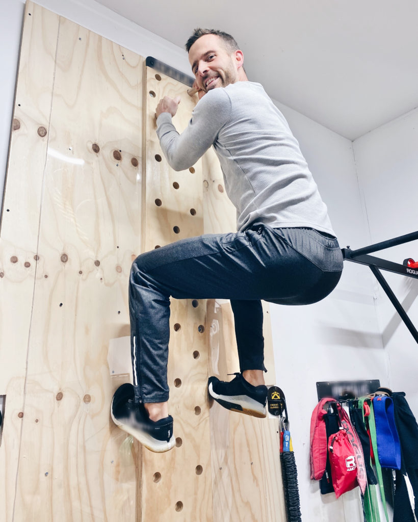 chris Moore of himteresting plans in home CrossFit gym in jockey workout gear 