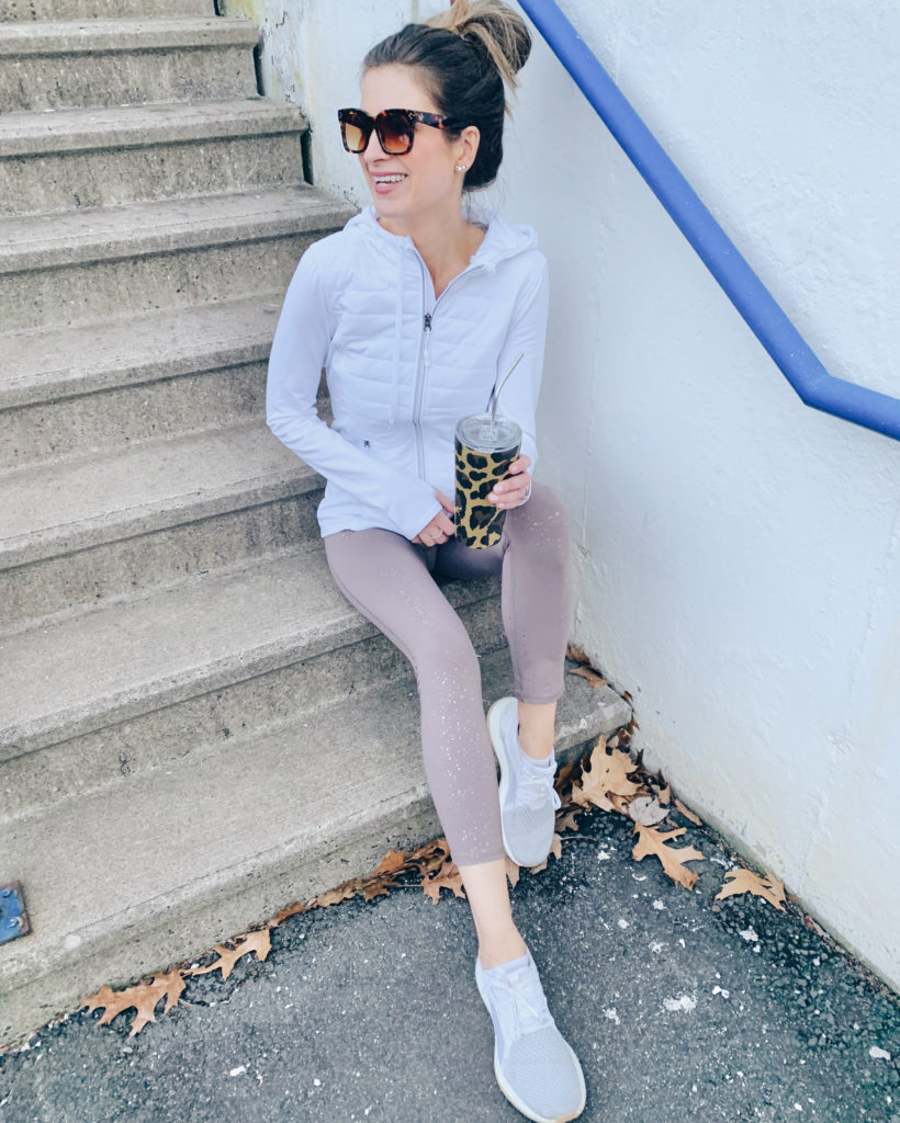 Rachel Moore wearing Jockey white hooded tech jacket and foil flecked metallic leggings- women’s athletic and athleisure wear on Pinteresting plans blog