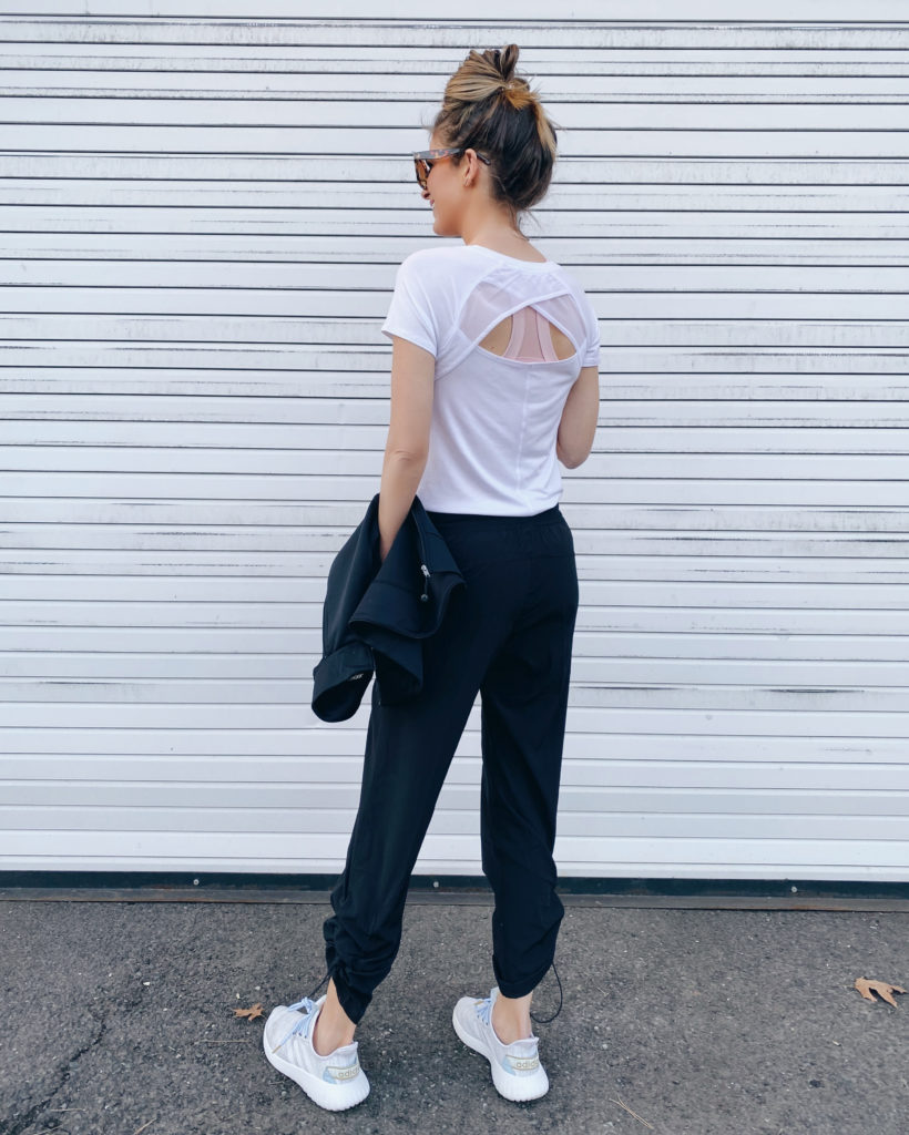 open back white mesh tee with black adjustable ankle pants - activewear and athleisure outfit