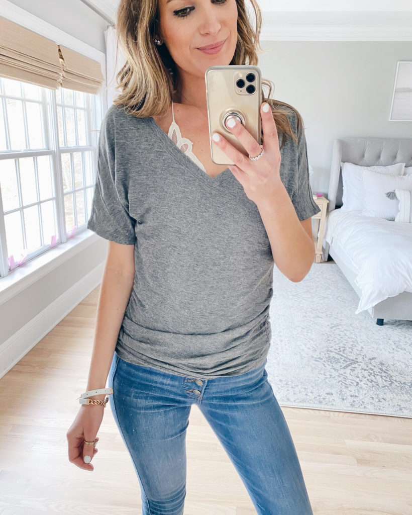fashion for moms in their 30s - gray ruched side dolman sleeve v-neck tee with exposed button fly jeans
