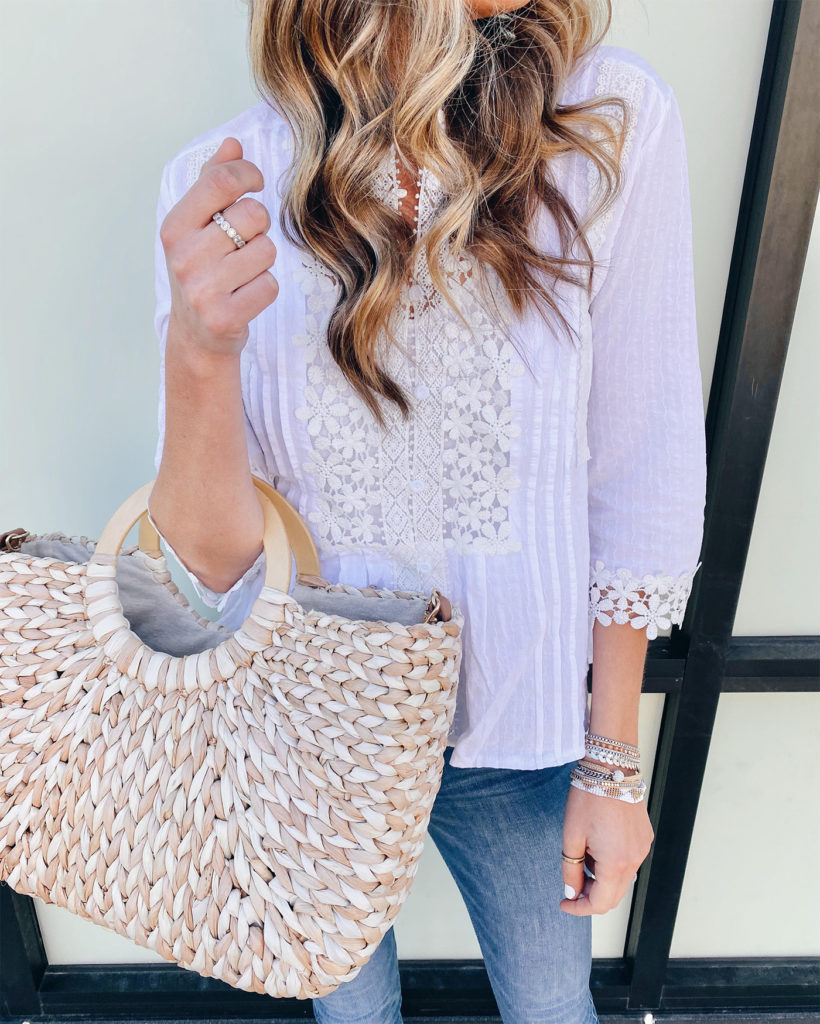 white lace floral crochet top from amazon with express button fly jeans and Victoria Emerson wrap bracelet