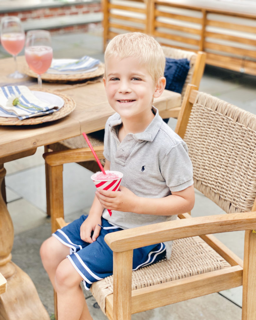 summer outdoor dining and entertaining ideas - little boy eating snowcone