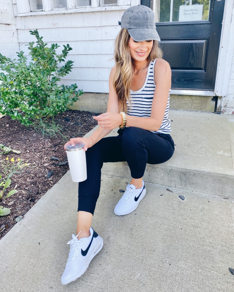 madewell stripe tank top with black joggers and nike air max oketo sneakers