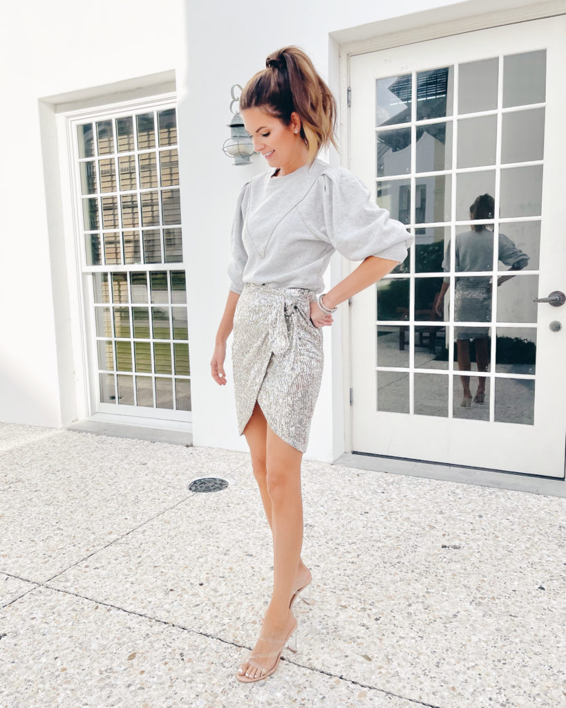 tall fashion blogger wearing holiday outfit express gray sweatshirt with sequin skirt