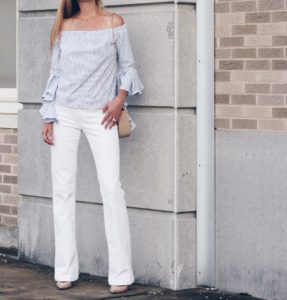striped off the shoulder top with bell sleeves paired with white wide leg denim