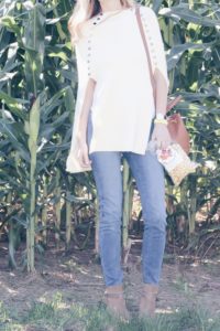 fall outfit: cream sweater cape with denim and booties
