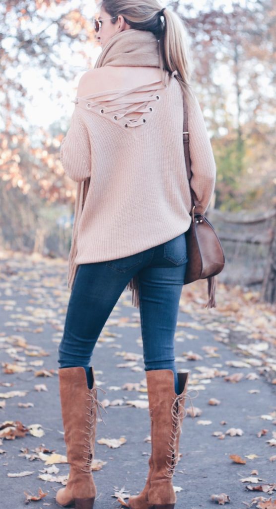 Casual Sweater and Leggings Outfit: Lace Up Sweater and Suede Boots with Denim Leggings