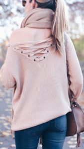 reversed lace up sweater and denim leggings