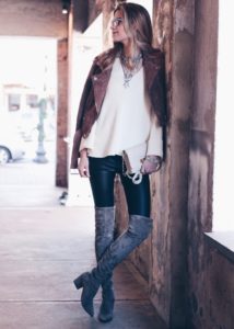 leather leggings outfit: over the knee suede boots and brown suede moto jacket with white free people sweater and bib necklace