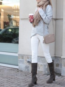 winter outfit: nursing crossover sweater with white skinny cords and Sorel leather snow boots