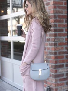 spring outfit: long pink sweater cardigan with gray skinny jeans and heels