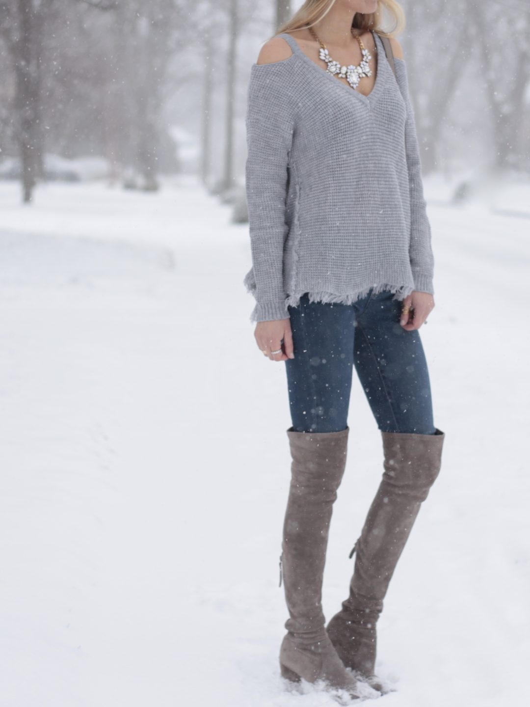 winter outfit: gray thermal cold shoulder sweater and jeggings with over the knee boots