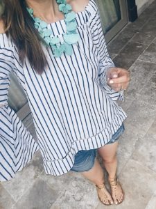 blue striped off the shoulder top with turquoise necklace and rock stud flat sandals