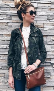 spring outfit idea: lace peplum top with camo jacket and skinny jeans