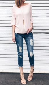 spring outfit idea: pink ruffle sleeve top with distressed cropped denim and wedges