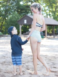 pinterestingplans in high waisted bikini playing with son