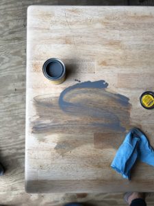 farmhouse coffee table makeover - gray stain on sanded tabletop