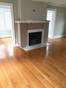 fireplace makeover before and after - covering the brick with wood panels