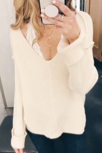 cute bralettes tp add to your winter wardrobe - white halter bralette under v-neck sweater.JPG
