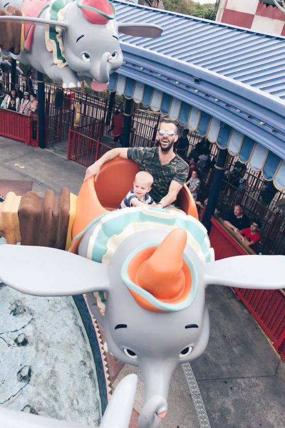 how to save on a Disney vacation - father and son on the Dumbo ride