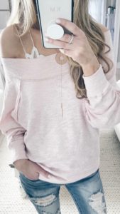 spring outfit ideas - slouchy sweatshirt over bralette with distressed skinny jeans