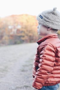 fall layers for the family - toddler boy in patagonia jacket and hat