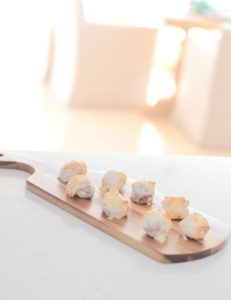 serve finger foods on a cutting board at a fun holiday party - pinteresting plans blog