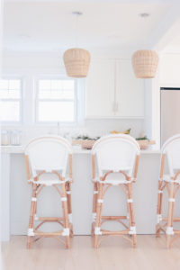 winter home decor in the kitchen - evergreen branches in wood dough bowl