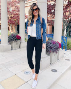norstrom sanctuary kyle crop denim jacket with white lace cami black joggers and converse sneakers