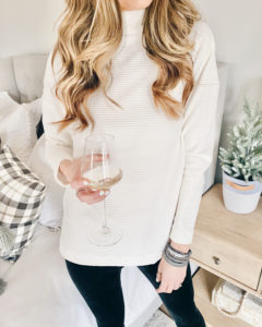 Target a new day cream mock turtleneck velour rib tunic sweatshirt with Jockey black velvet leggings and Victoria Emerson wrap bracelet