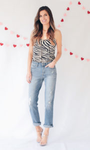 Valentine’s day outfit ideas - tan black zebra print slip cami with distressed cuffed high waist straight crop jeans